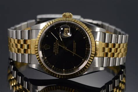 vintage gold silver rolex black face|Rolex date just black dial.